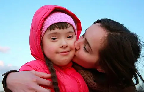 What are the causes of Down Syndrome?